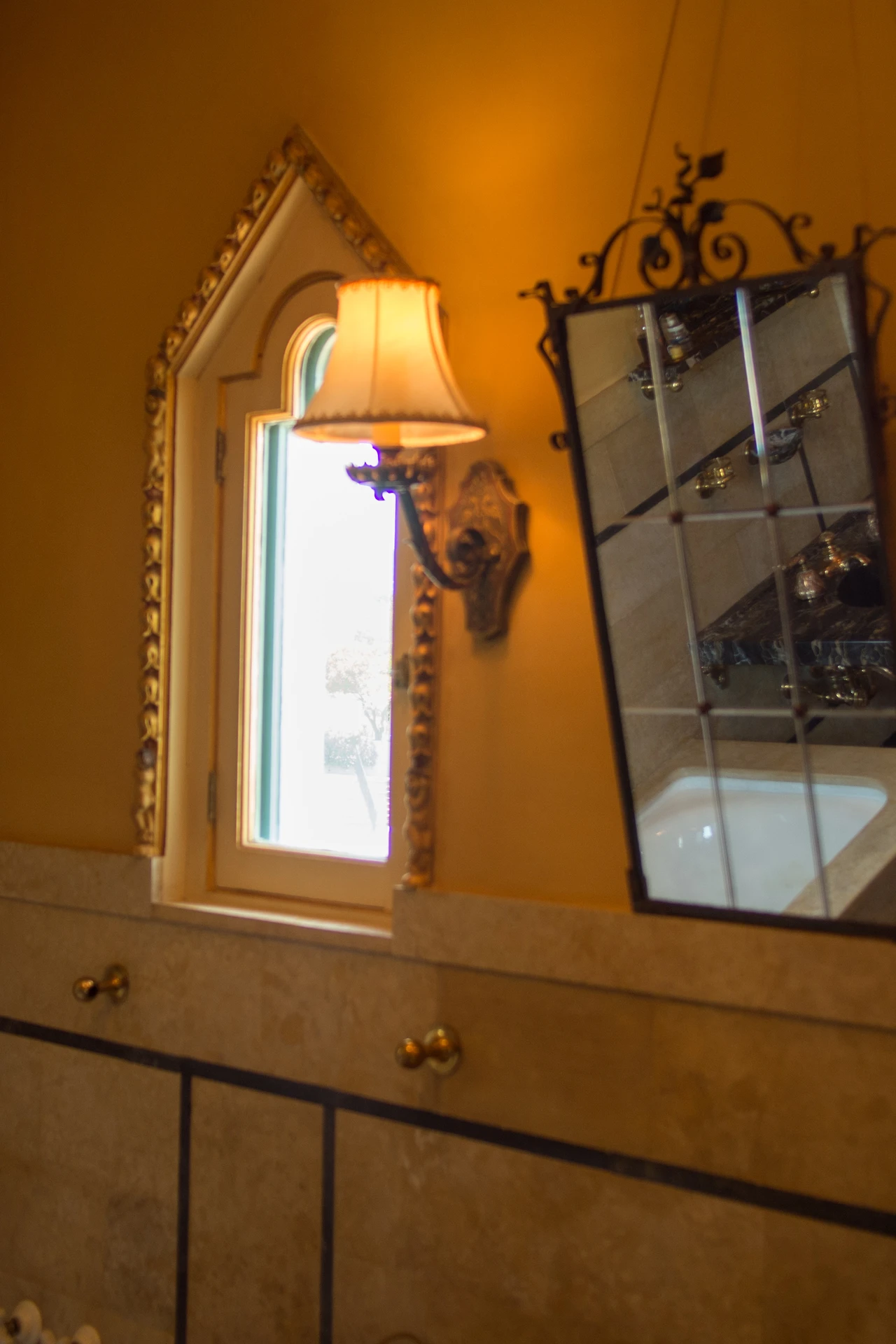 Frosted glass globe shades on a bathroom vanity light fixture glowing warmly