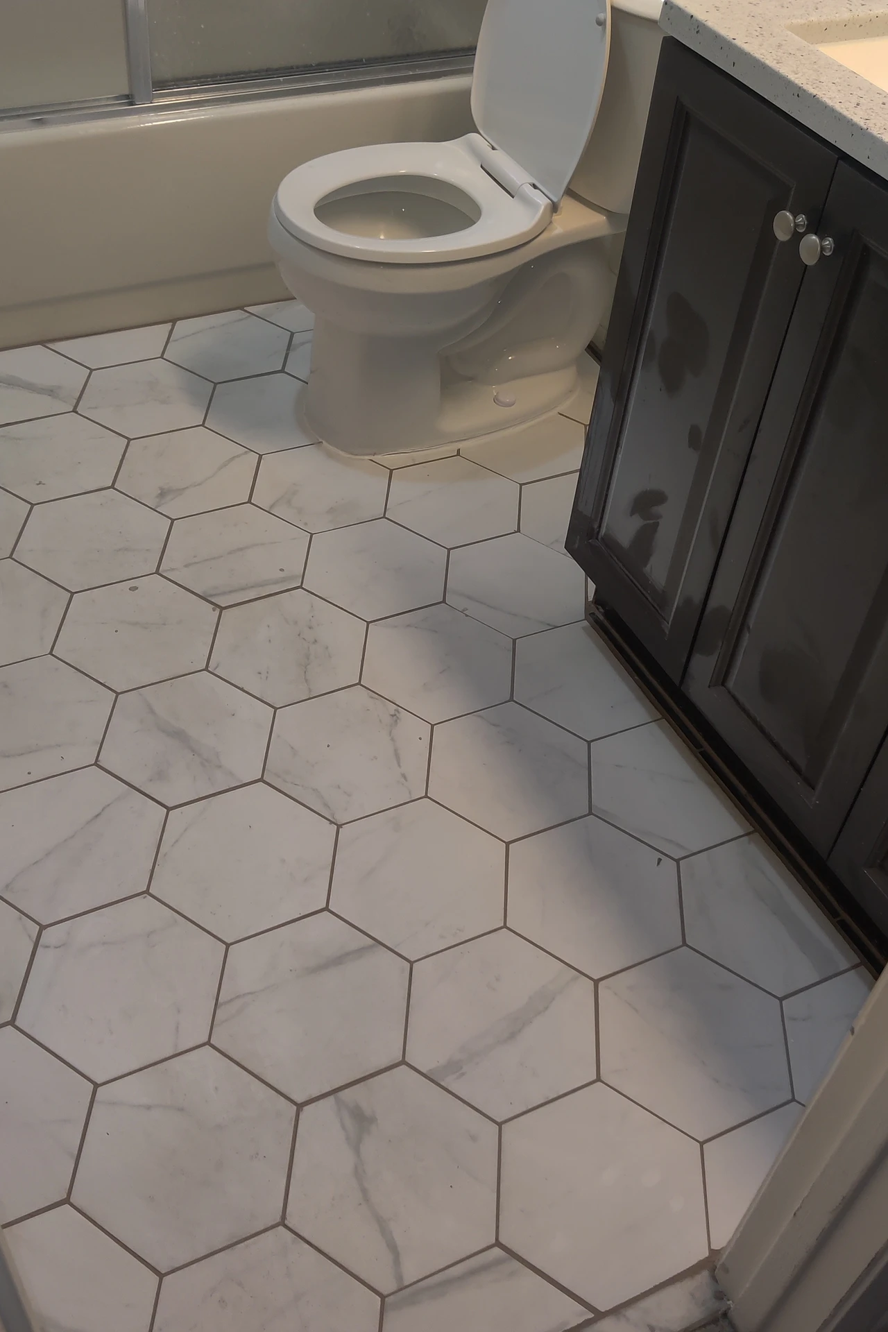 Peel-and-stick tiles as a splashback behind a modern bathroom vanity