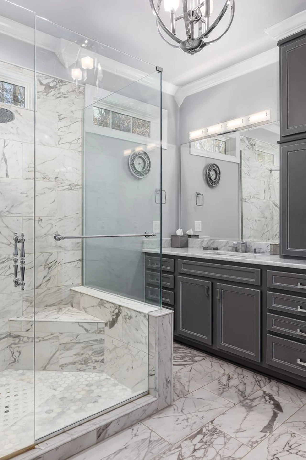 Deep charcoal painted bathroom vanity with white sink and mirror