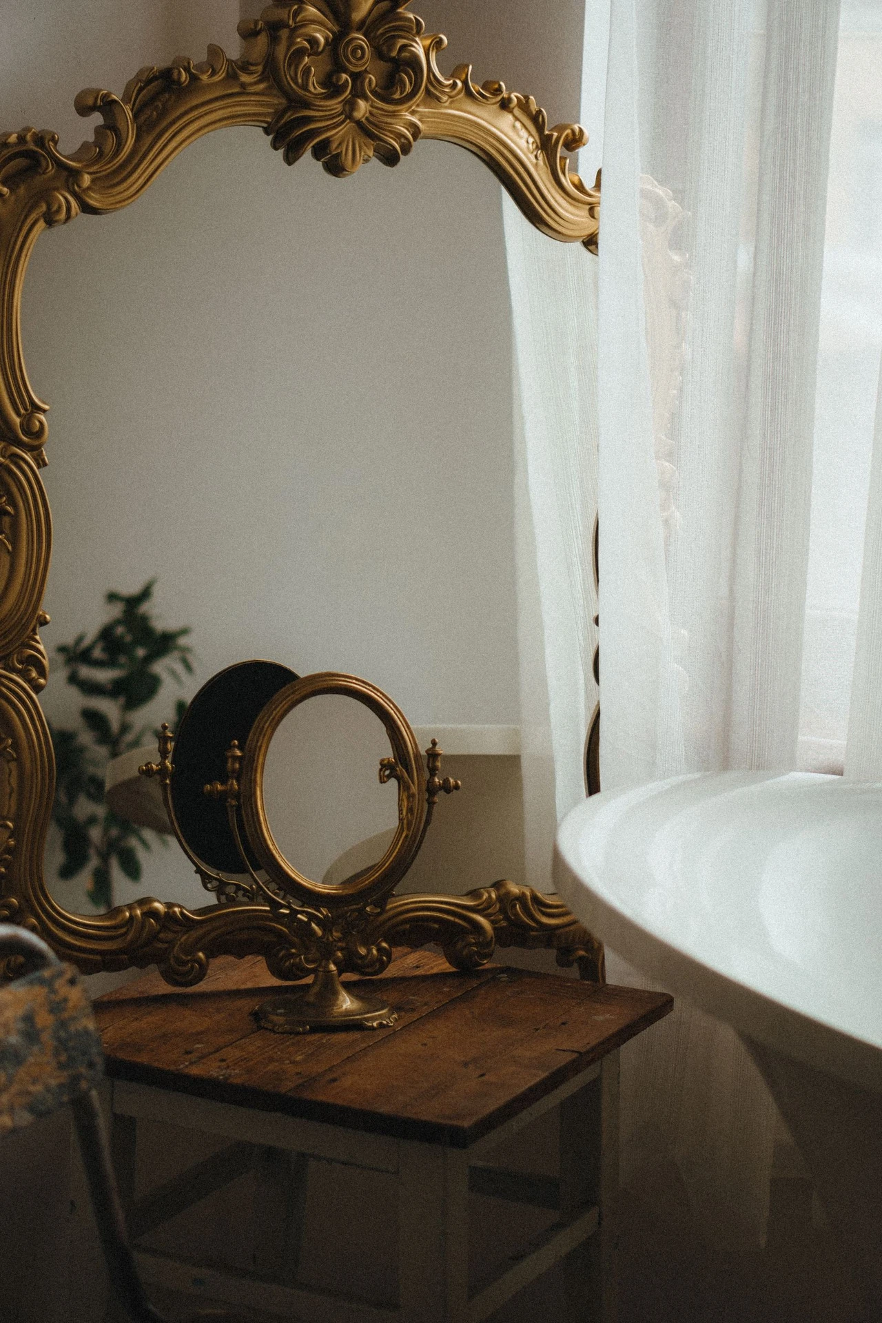 Plain bathroom mirror framed with dark wood trim