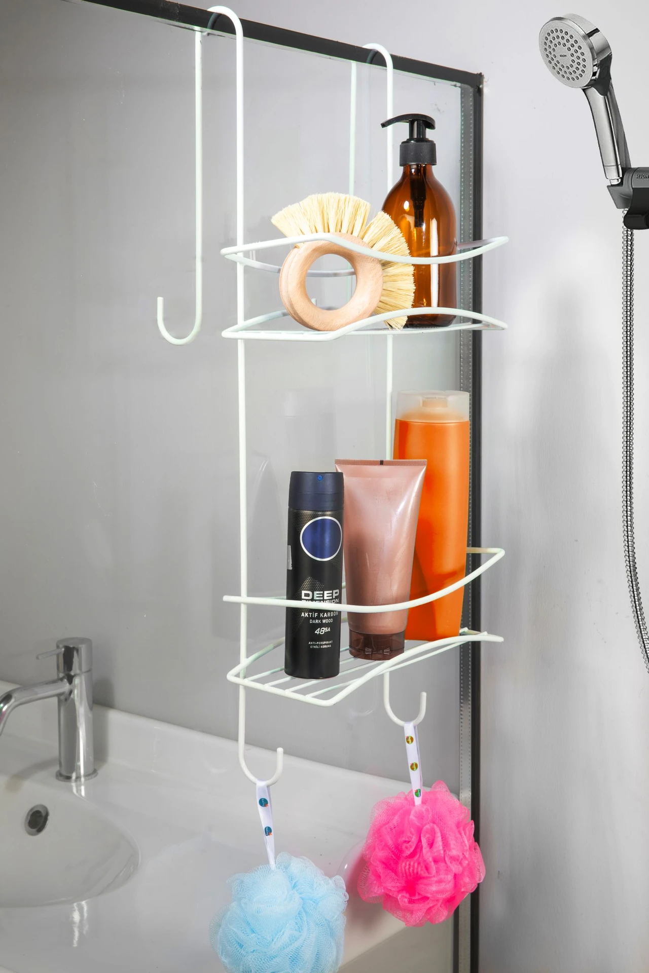 Shower caddy with bottles hanging in a clean modern shower