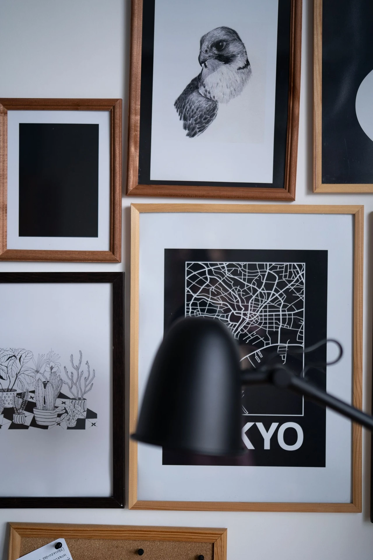 Botanical art prints in black frames on a bathroom wall