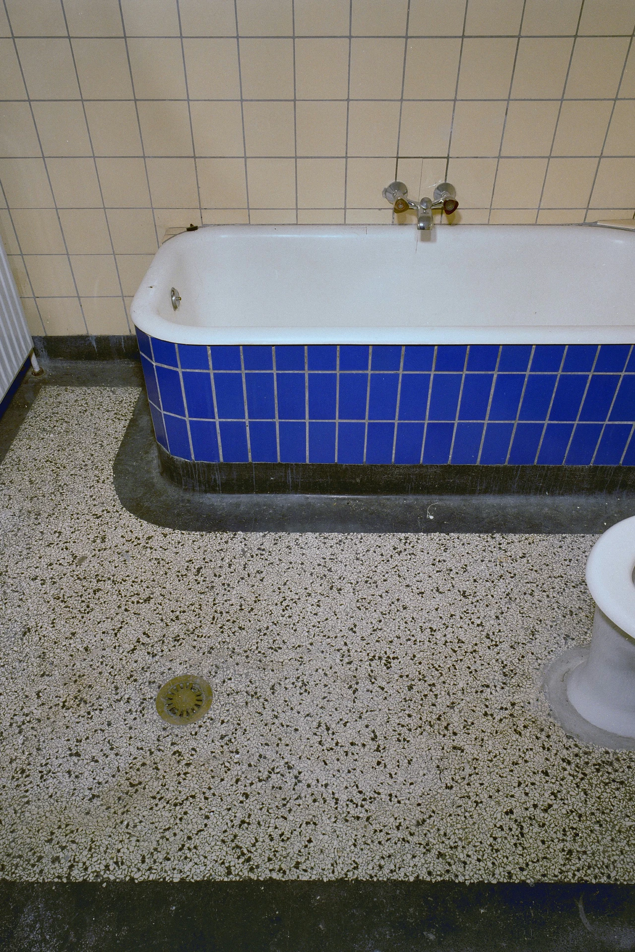 Terrazzo Print Without the Renovation in a cozy budget bathroom with soft natural light
