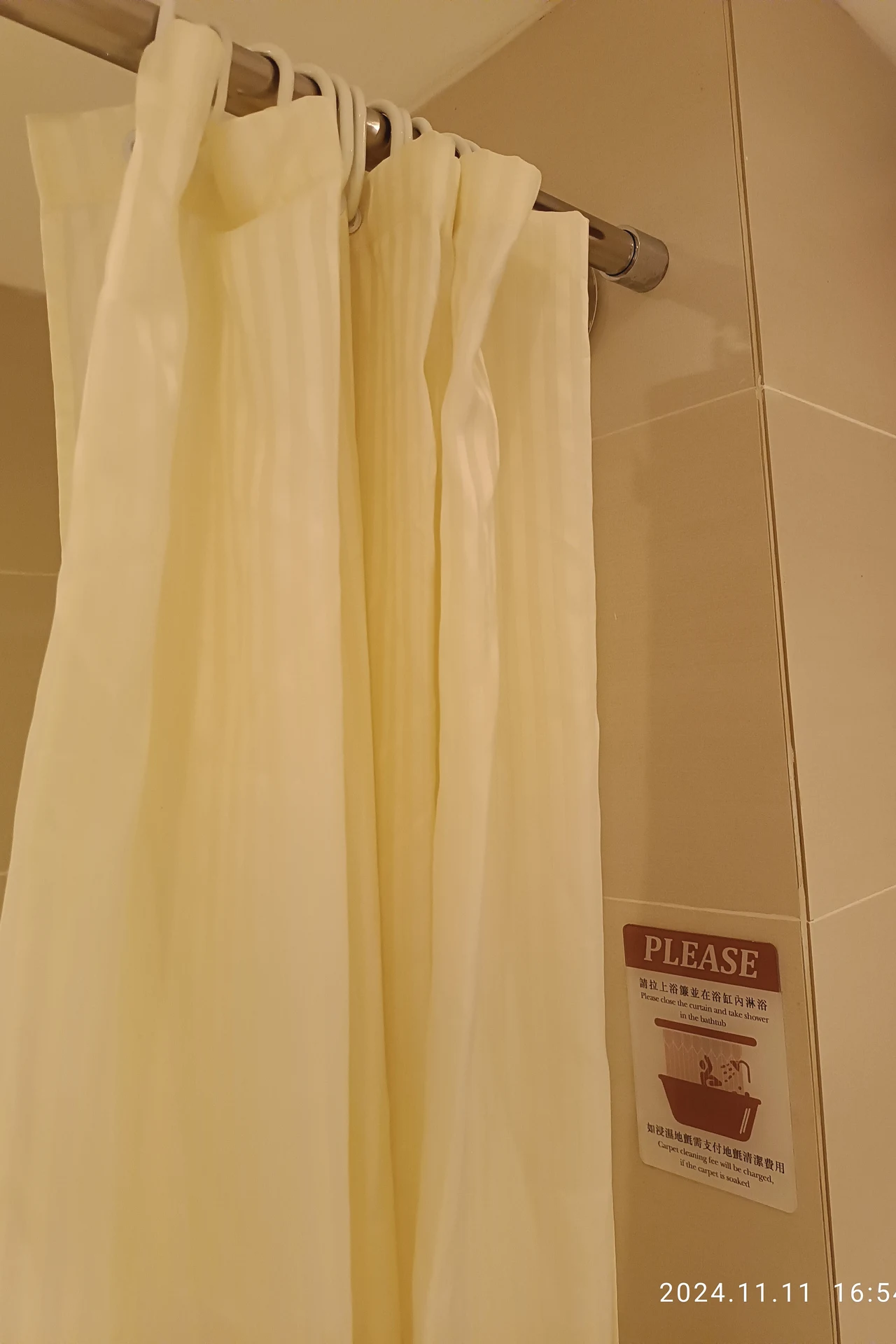 Double Curtains: Sheer Outer, Waterproof Inner in a cozy budget bathroom with soft natural light