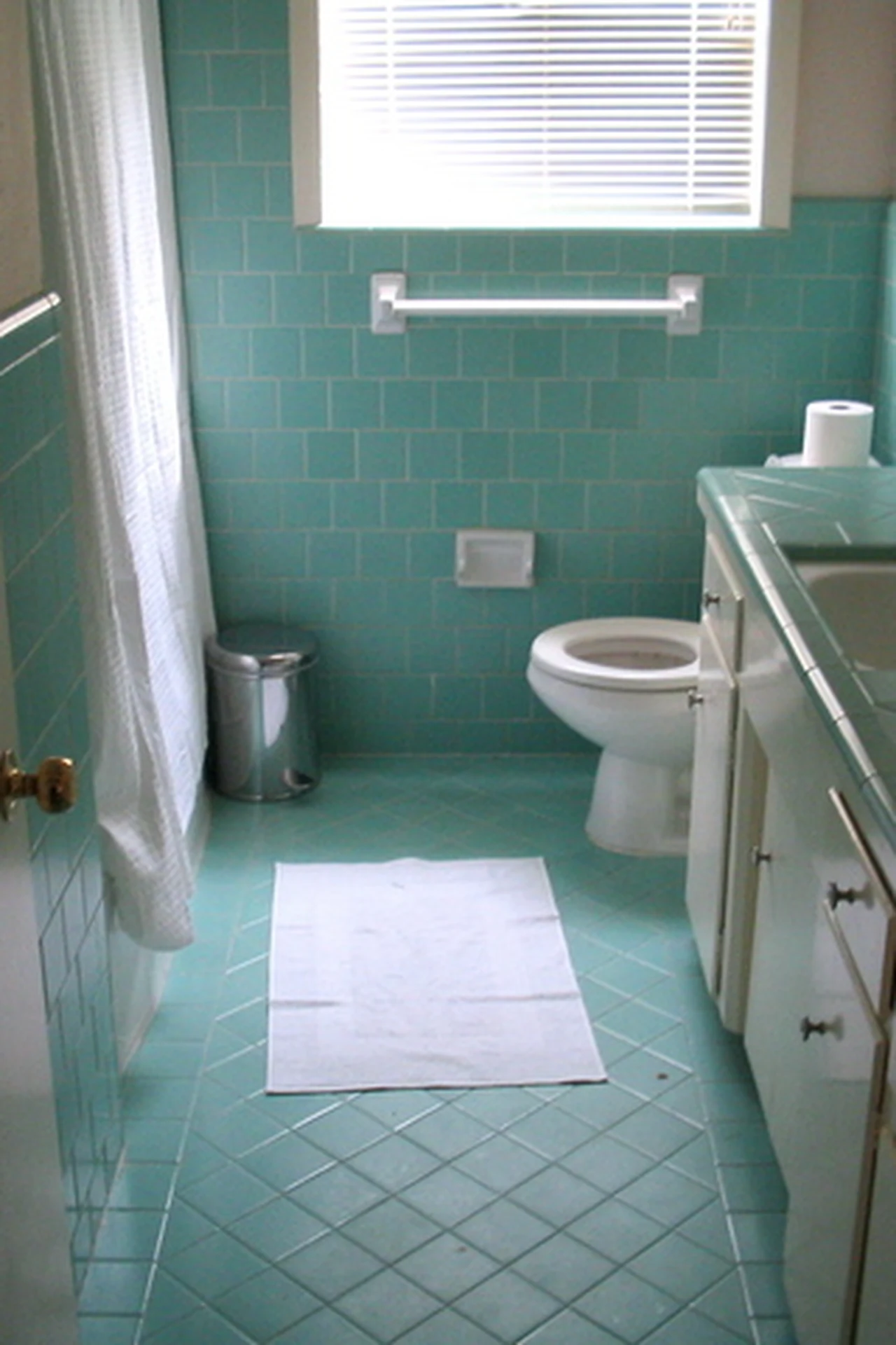 Muted Rainbow Arches for a Playful Bath in a cozy budget bathroom with soft natural light