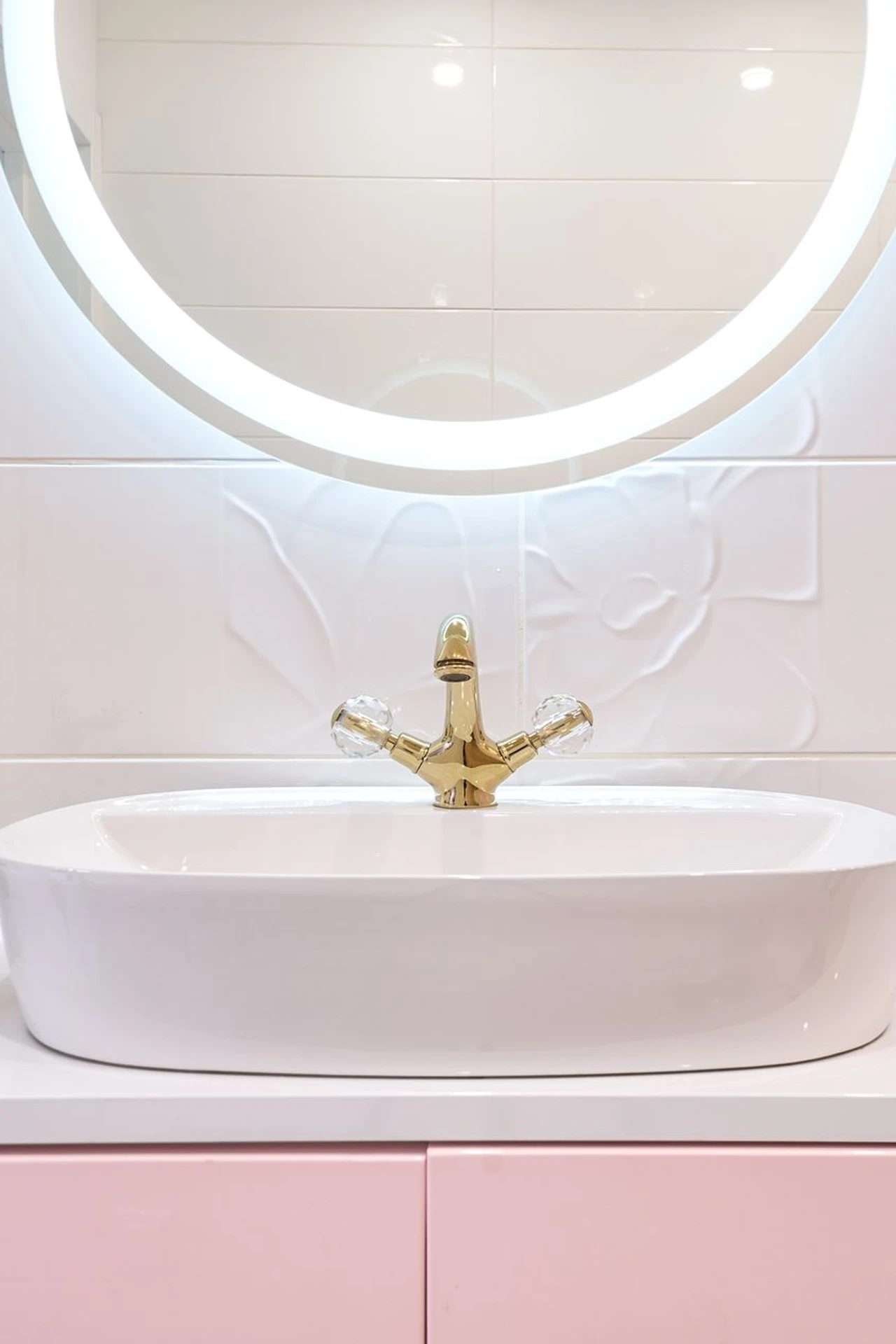 Bathroom mirror with a mustard painted frame above a sink