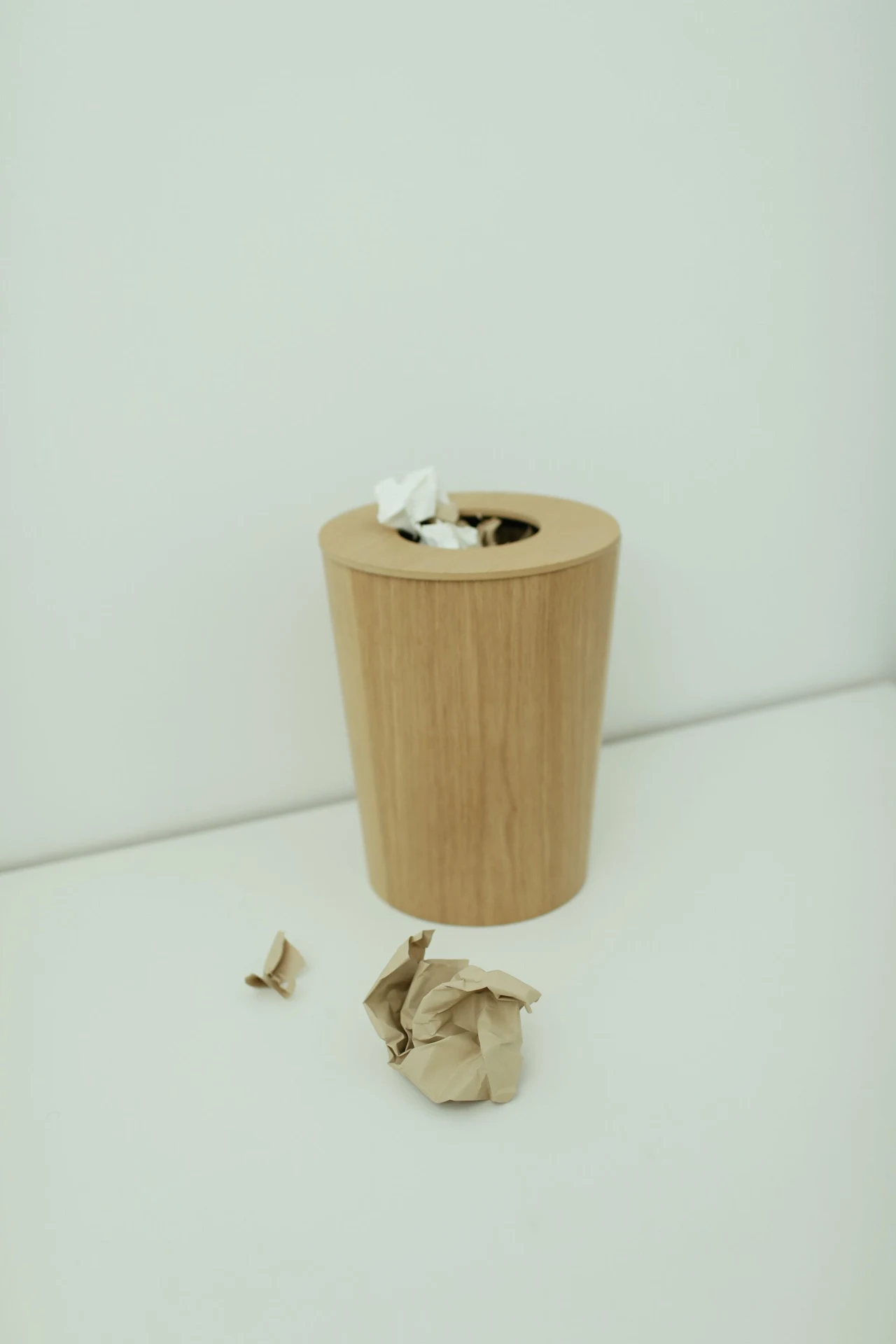 Matching mustard wastebasket and tissue box in a bathroom