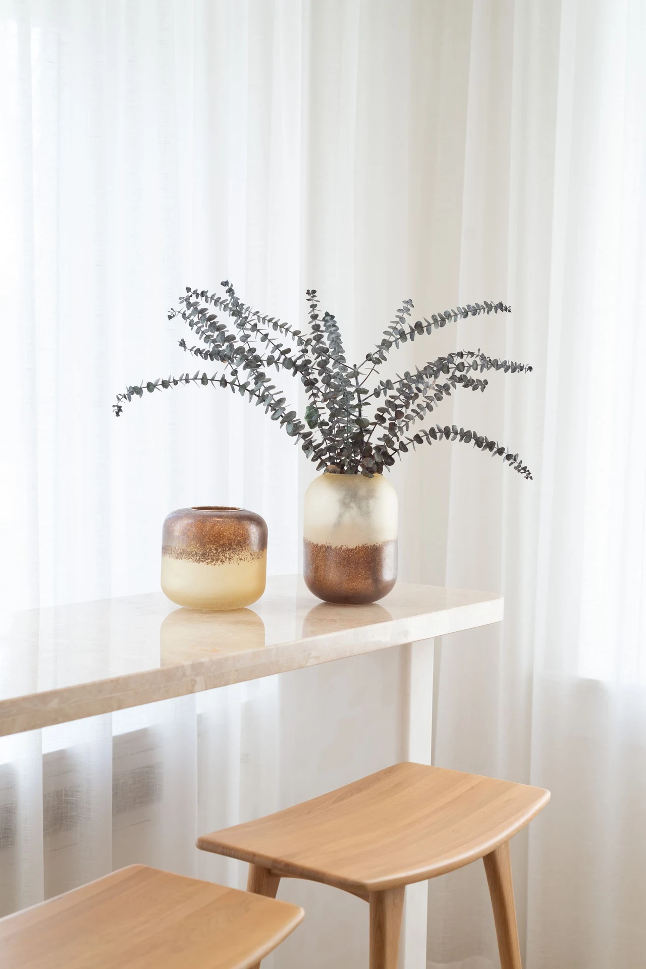 Eucalyptus bundle tied with mustard ribbon in a glass jar