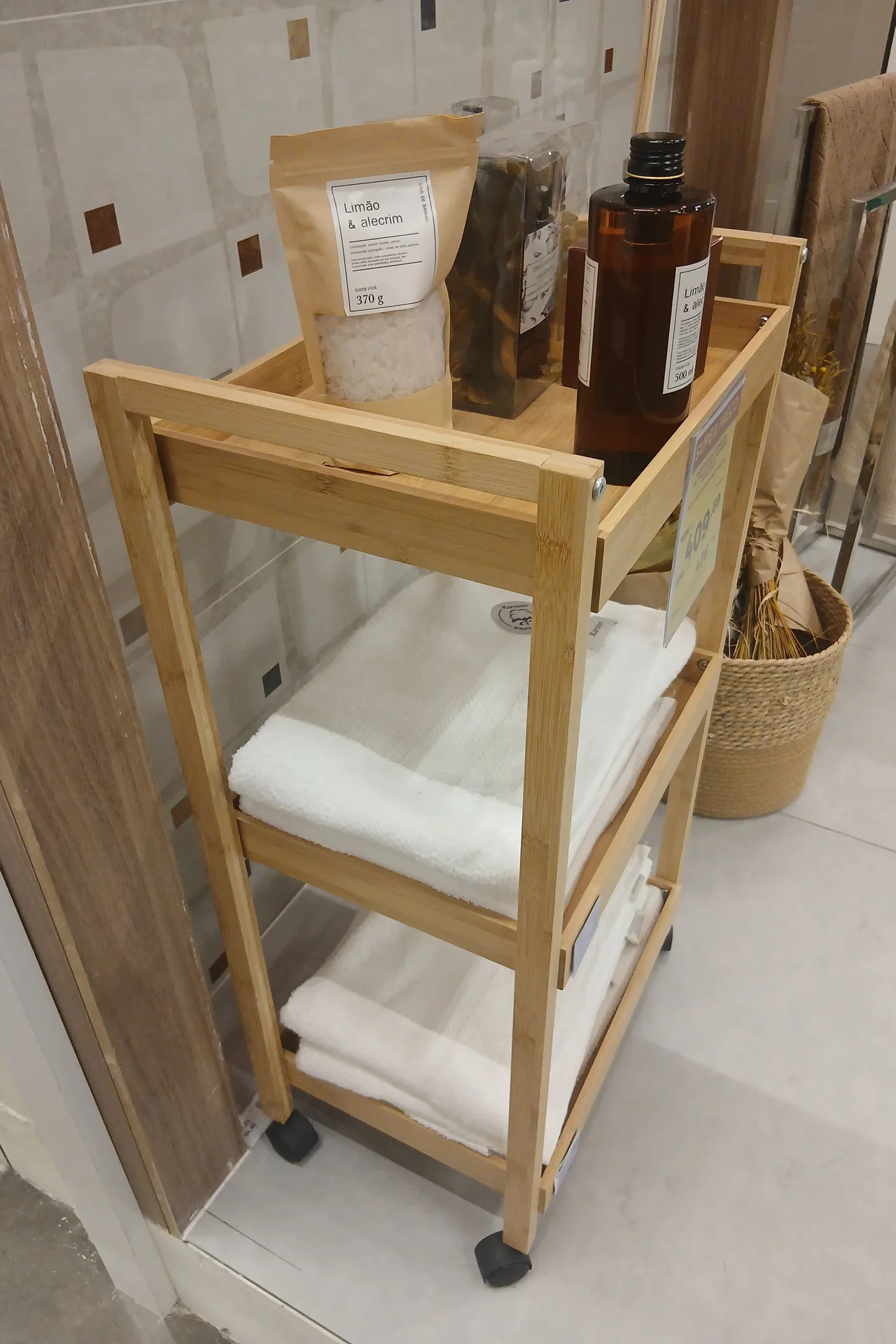 Slim rolling storage cart beside a bathroom vanity