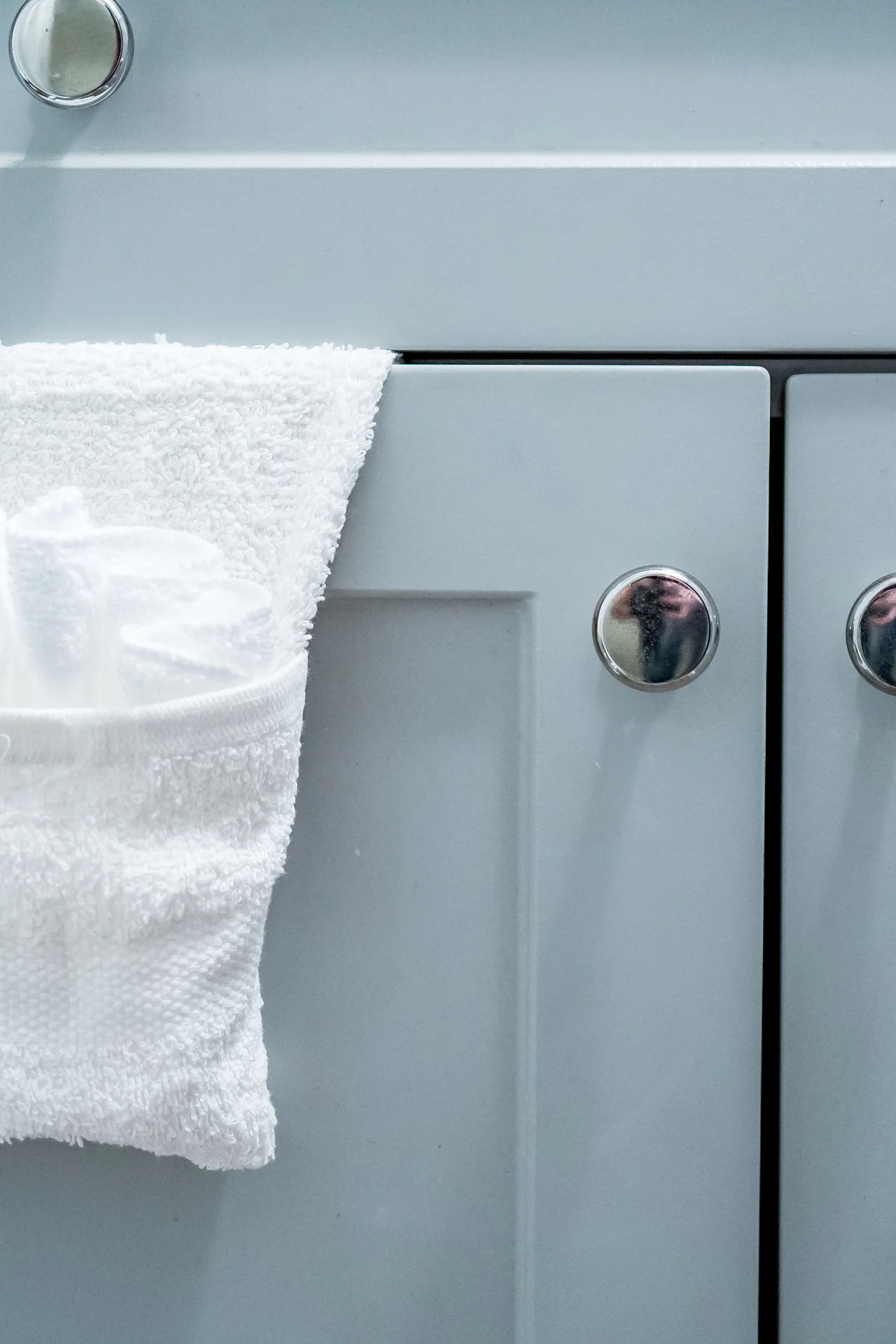 Magnetic strip inside a cabinet door holding bobby pins