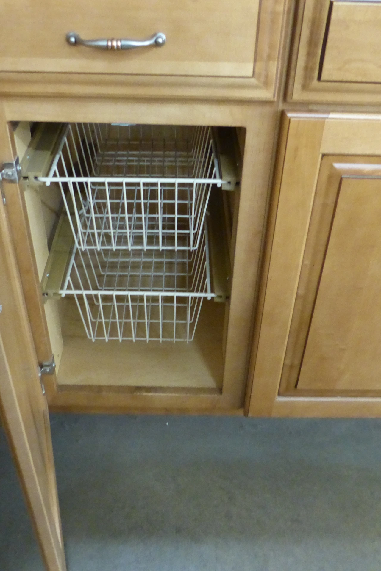 Matching baskets stored above kitchen cabinets