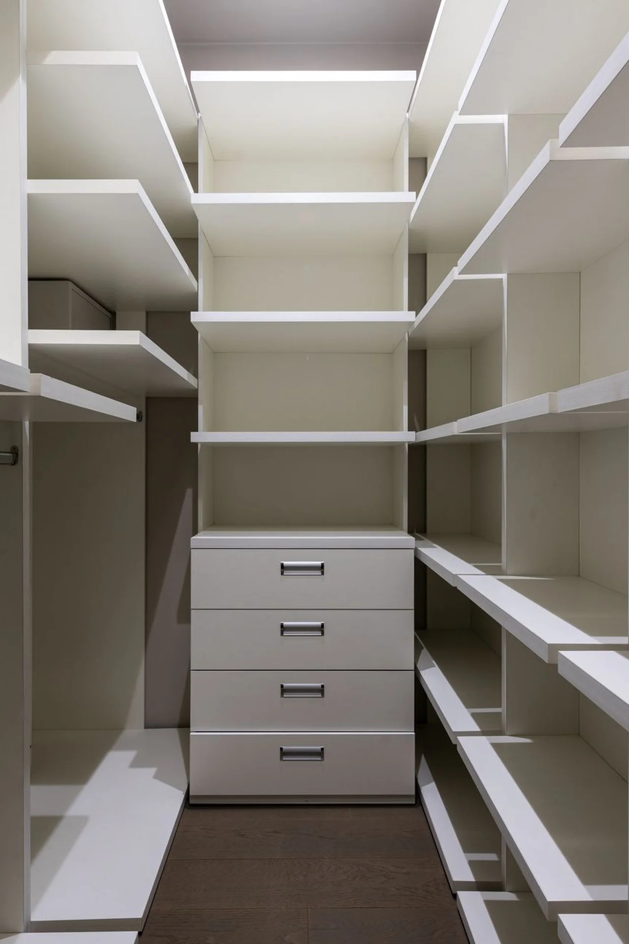 Slim sliding-door wardrobe in a narrow tiny bedroom