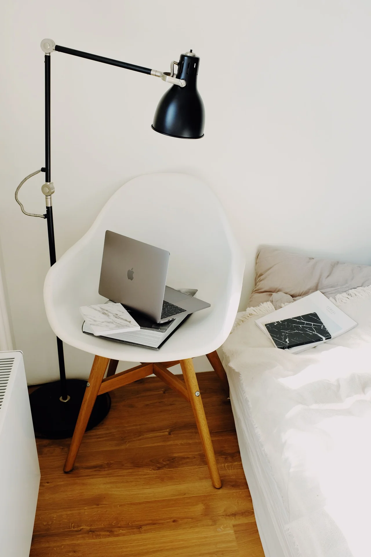 Clear acrylic chair in a bright tiny bedroom corner