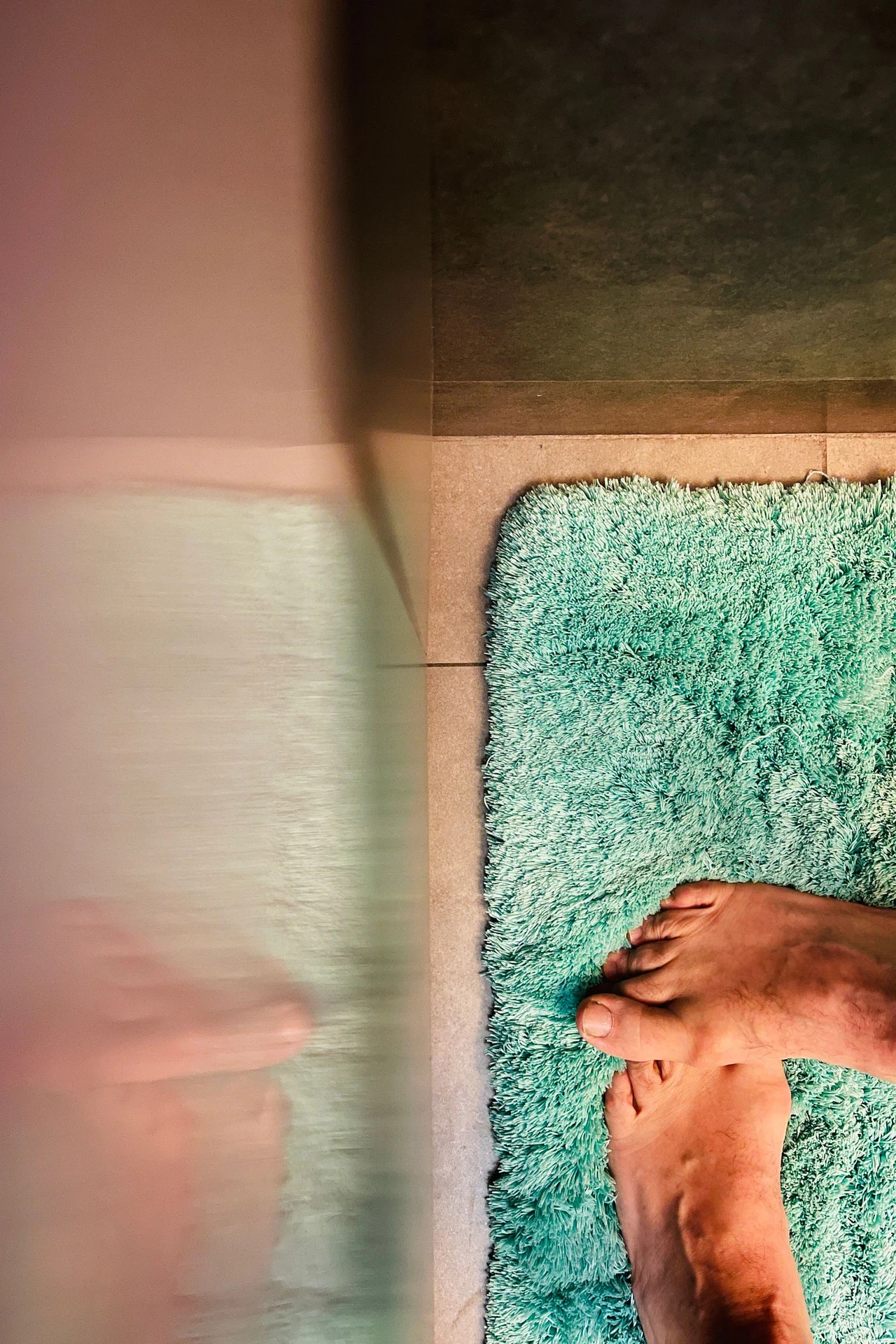 Washable bath rug on a small bathroom floor