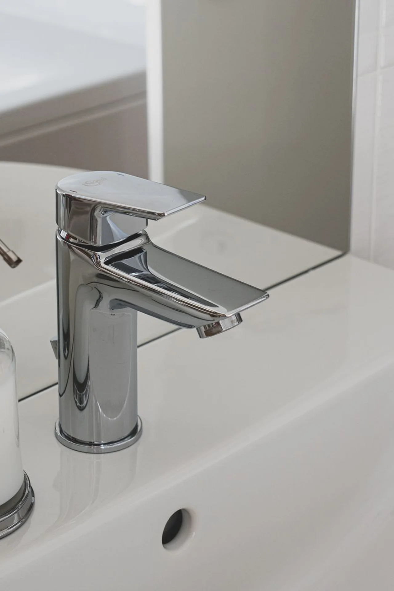 Matching soap dispensers on a small bathroom sink