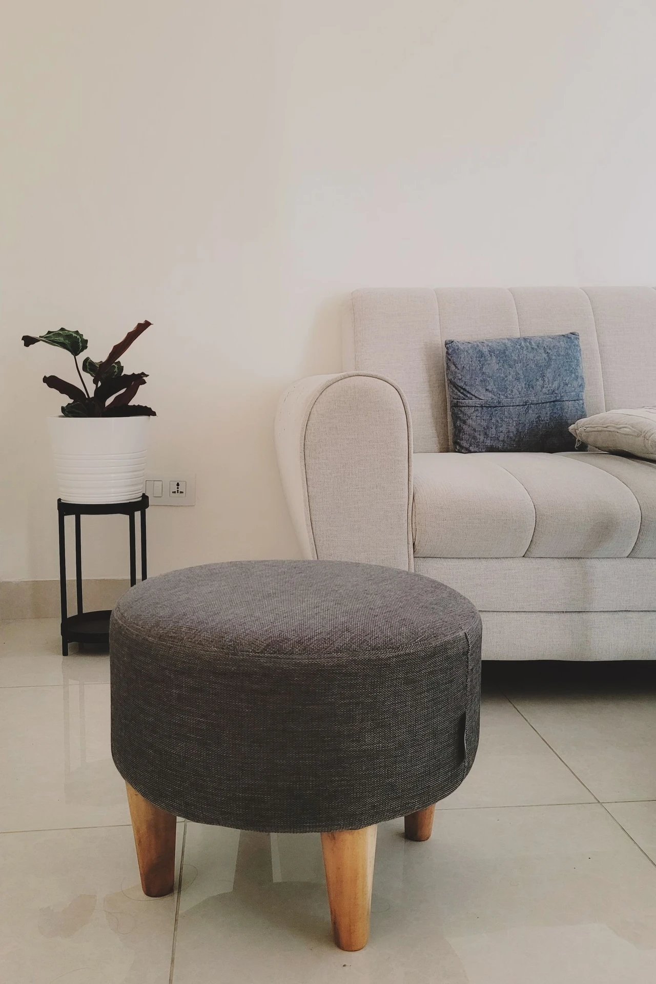 Hide Storage Inside an Ottoman in a small apartment