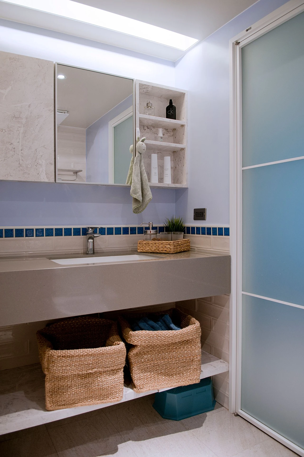 Organize Under the Sink With a Stackable Shelf in a small apartment