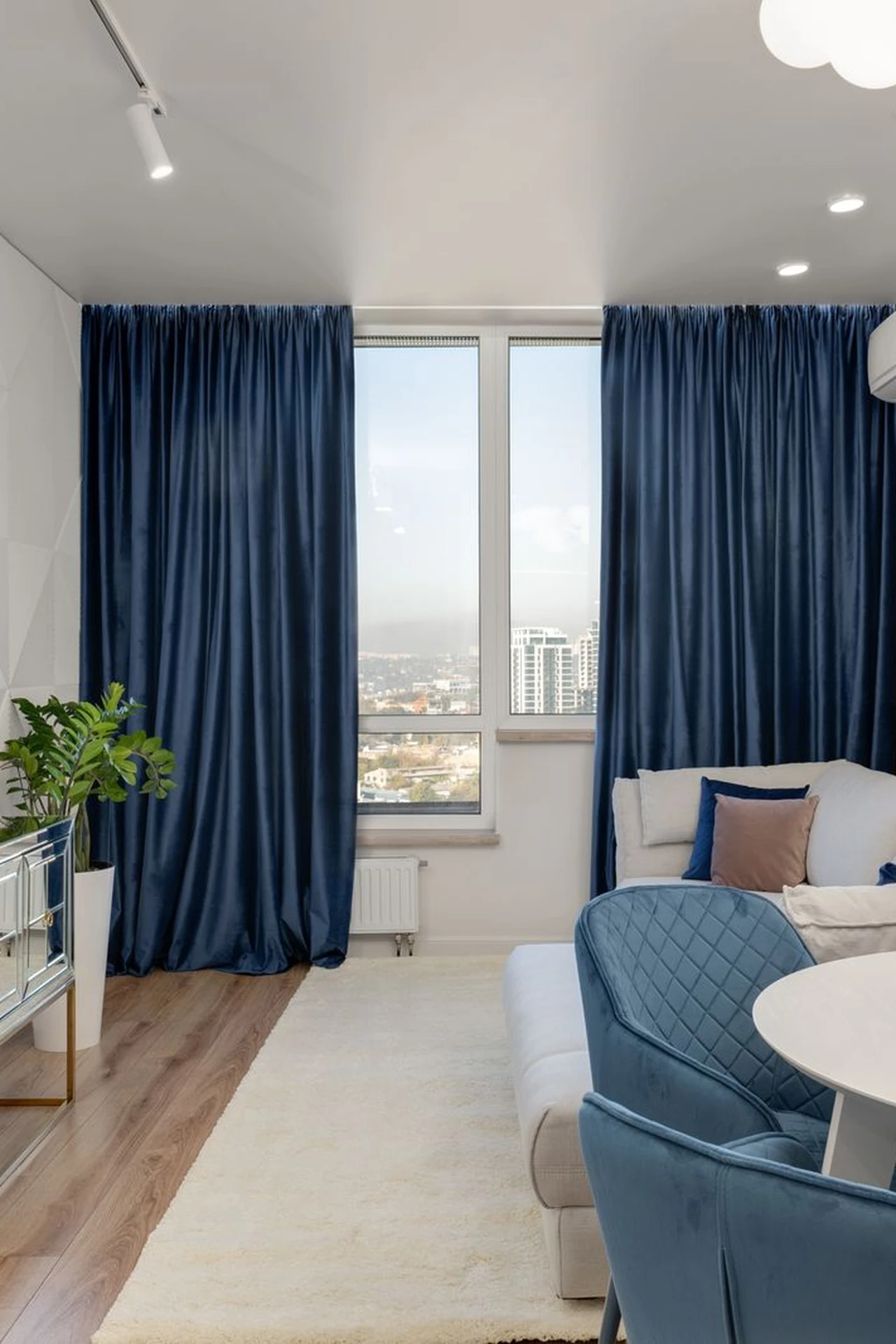Hang Curtains High and Wide in a small apartment