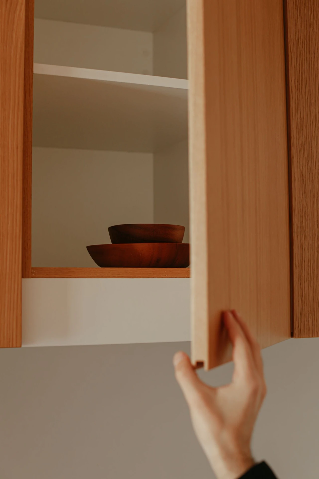 Stick Hooks Inside Cabinet Doors in a small apartment