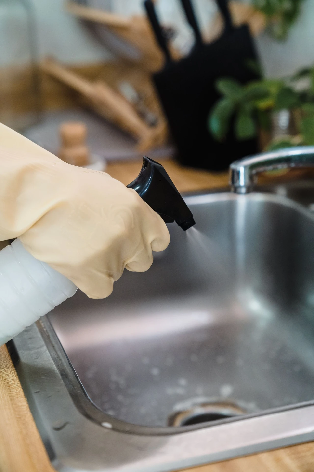 Hang a Tension Rod Under the Sink in a small apartment