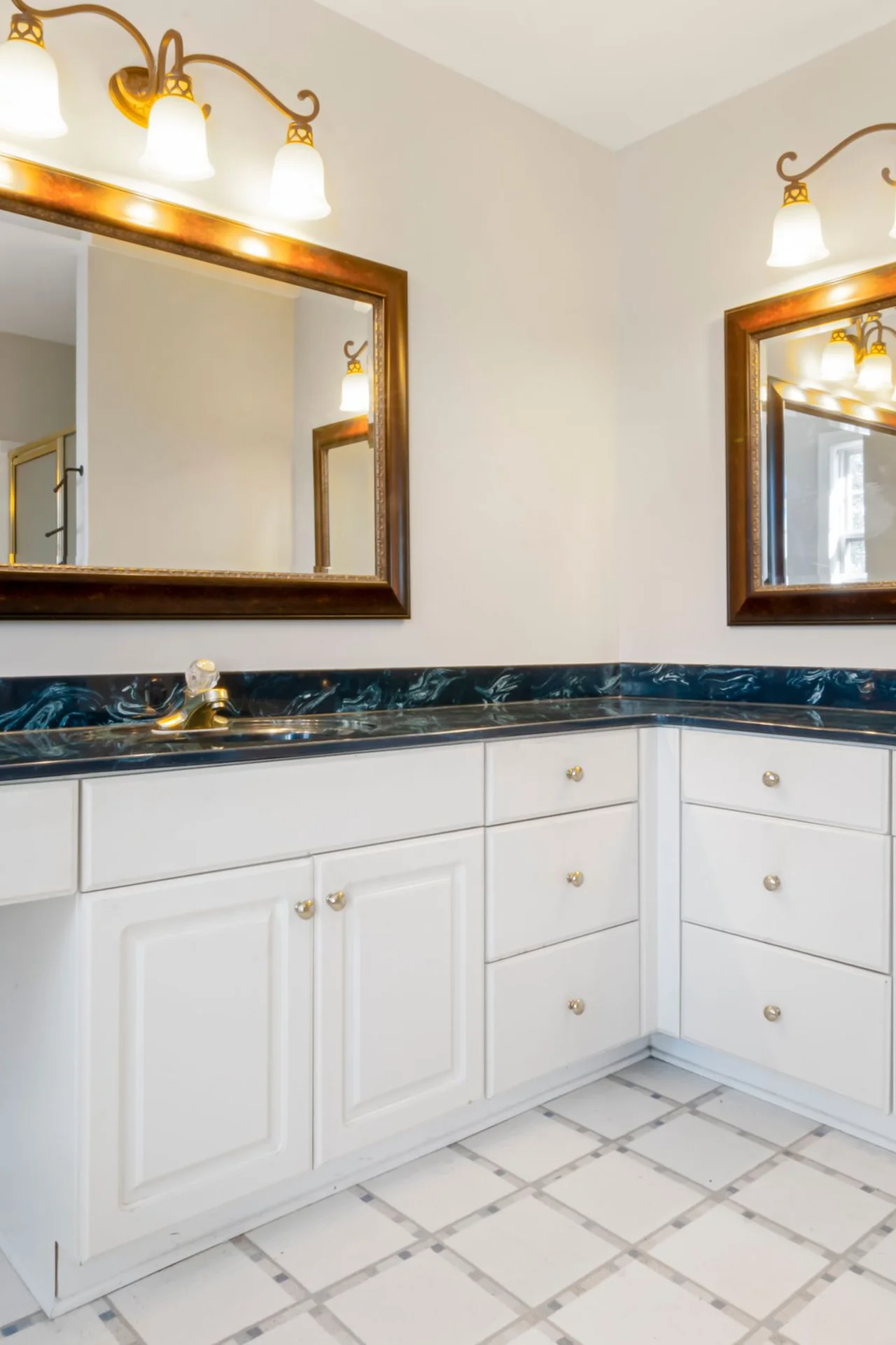 Add a Mirror Cabinet Organizer With Command Strips in a small budget-friendly apartment