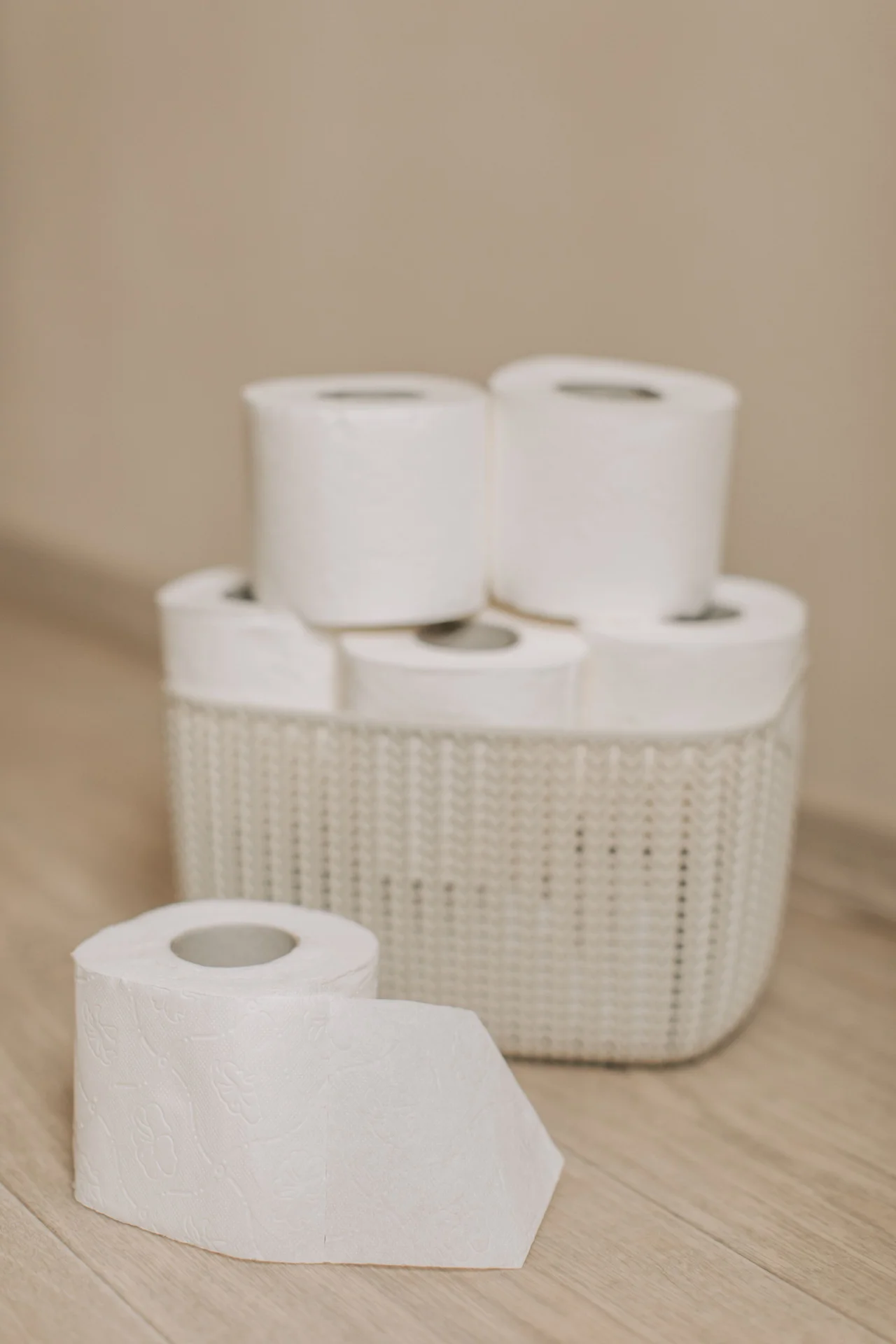 Roll Towels Into a Woven Basket in a small budget-friendly apartment