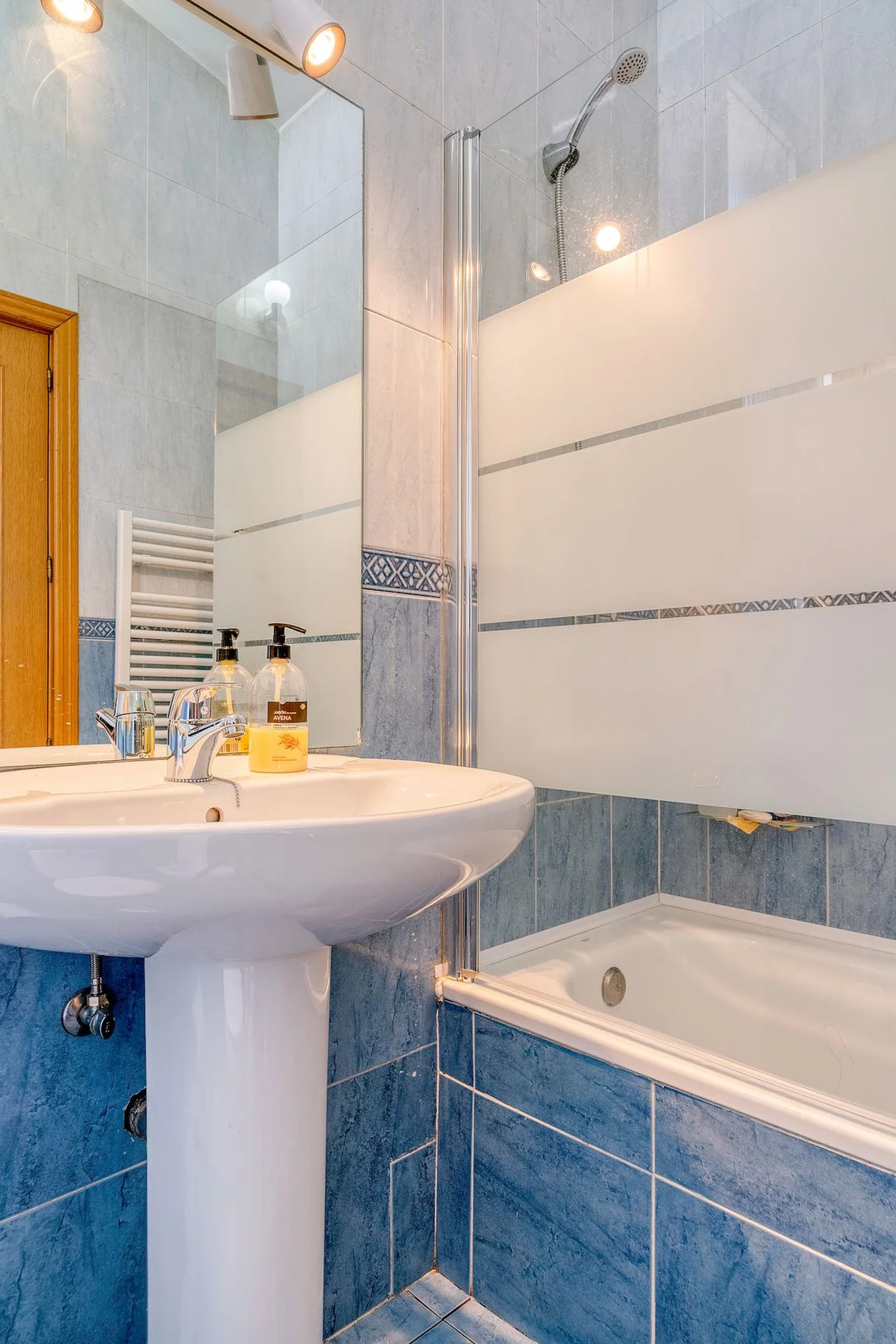 Lay Waterproof Peel-and-Stick Floor Tiles in a small budget-friendly apartment